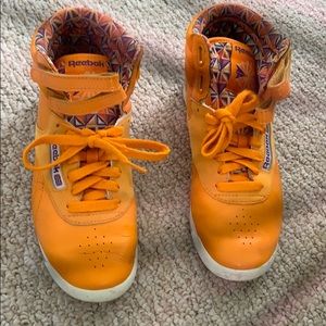 Orange classic Reebok sneakers